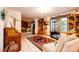 Cozy living room with tile floors, decor items and large windows to let in natural light at 1059 S Elbert St, Elizabeth, CO 80107