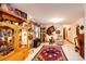 Charming living room with decorative area rug, tile floor, unique decor and neutral paint at 1059 S Elbert St, Elizabeth, CO 80107