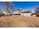 A view of the backyard and back of the home at 15716 E Temple Pl, Aurora, CO 80015