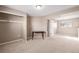 Bedroom featuring a closet, neutral walls, carpet, and table at 15716 E Temple Pl, Aurora, CO 80015