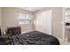 Bedroom showcasing neutral colors, a window, carpet floors, and closet space at 15716 E Temple Pl, Aurora, CO 80015