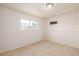 Bedroom featuring a window view, neutral colors, and carpet floors at 15716 E Temple Pl, Aurora, CO 80015