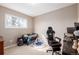 Bedroom featuring a window view, neutral colors, carpet floors, and a gaming chair at 15716 E Temple Pl, Aurora, CO 80015