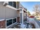 View of the wood porch, showing the brick facade and trim details at 15716 E Temple Pl, Aurora, CO 80015