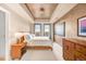 Spacious bedroom with wood furniture, large windows, and high ceilings at 150 S Madison St # 112, Denver, CO 80209