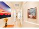 Bright hallway with hardwood floors and artwork at 150 S Madison St # 112, Denver, CO 80209