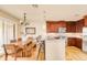 Modern kitchen with wood cabinets and granite counters at 150 S Madison St # 112, Denver, CO 80209