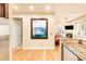 Kitchen features granite countertops and views to living room and fireplace at 150 S Madison St # 112, Denver, CO 80209