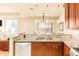 Granite kitchen island with sink and breakfast bar at 150 S Madison St # 112, Denver, CO 80209