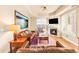 Spacious living room with fireplace and large windows at 150 S Madison St # 112, Denver, CO 80209