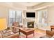 Cozy living room with fireplace and hardwood floors at 150 S Madison St # 112, Denver, CO 80209
