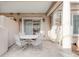 Private patio with small table and chairs at 150 S Madison St # 112, Denver, CO 80209