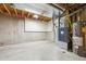 Unfinished basement area with exposed ductwork, a water heater, and concrete walls at 22455 E Plymouth Cir, Aurora, CO 80016