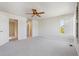 Spacious bedroom with a ceiling fan and ample closet space at 22455 E Plymouth Cir, Aurora, CO 80016