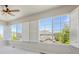 Bright bedroom featuring large windows with plantation shutters allowing natural light at 22455 E Plymouth Cir, Aurora, CO 80016