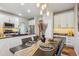 Cozy dining area with elegant table setting, pendant lighting, and adjacent kitchen at 22455 E Plymouth Cir, Aurora, CO 80016