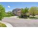 View of a well-maintained home with a landscaped yard in a neighborhood with mature trees at 22455 E Plymouth Cir, Aurora, CO 80016