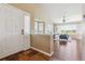 Inviting foyer with hardwood floors, bright natural light and an open view to the living area at 22455 E Plymouth Cir, Aurora, CO 80016