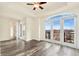 Bedroom with ceiling fan and access to a balcony with scenic city views at 1827 N Grant St # 604, Denver, CO 80203