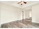 Spacious bedroom featuring wood-look flooring and a modern ceiling fan at 1827 N Grant St # 604, Denver, CO 80203