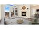 Cozy living room with a fireplace, balcony access, and ample natural light at 1827 N Grant St # 604, Denver, CO 80203