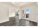 Elegant living area with a chandelier and French doors that lead to a balcony at 1827 N Grant St # 604, Denver, CO 80203