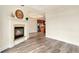 Open-concept living room features a fireplace and views into the kitchen, perfect for entertaining at 1827 N Grant St # 604, Denver, CO 80203