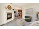 Open living room with a fireplace and views into the dining room and kitchen at 1827 N Grant St # 604, Denver, CO 80203