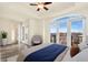 Comfortable bedroom with a ceiling fan and balcony access with views of the city at 1827 N Grant St # 604, Denver, CO 80203