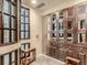 Private wine room with built-in storage, shelving, and tasting area at 1827 N Grant St # 604, Denver, CO 80203