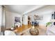 Spacious living area with hardwood floors, modern decor, and a view into the kitchen at 3663 S Sheridan Blvd # P1, Denver, CO 80235