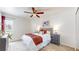 Bright bedroom with a cozy bed, ample natural light, and stylish bedside tables at 3663 S Sheridan Blvd # P1, Denver, CO 80235