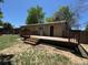 Spacious backyard with a wooden deck at 16753 E Ithaca Pl, Aurora, CO 80013