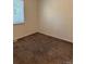 This bright bedroom features light neutral carpet and fresh paint throughout at 16753 E Ithaca Pl, Aurora, CO 80013