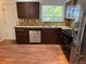 This lovely kitchen features wood cabinets and stainless steel appliances at 16753 E Ithaca Pl, Aurora, CO 80013