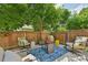 Charming patio area with comfortable seating and mature trees providing shade, perfect for outdoor relaxation at 6468 S Forest St, Centennial, CO 80121