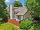 Fenced backyard with mature trees and a well-maintained lawn for outdoor enjoyment at 6468 S Forest St, Centennial, CO 80121