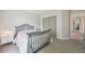 Bright bedroom with neutral walls, soft carpet, and ample natural light from a nearby window at 6468 S Forest St, Centennial, CO 80121