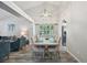 Bright dining room featuring vaulted ceiling, hardwood floors, and a modern light fixture at 6468 S Forest St, Centennial, CO 80121