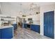 Stylish kitchen featuring two-tone cabinetry, modern appliances, and hardwood floors at 6468 S Forest St, Centennial, CO 80121