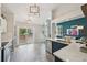 Open concept kitchen area with stainless steel appliances and modern finishes at 6468 S Forest St, Centennial, CO 80121