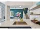Modern kitchen featuring stainless steel sink, white marble counters, and open floor plan at 6468 S Forest St, Centennial, CO 80121