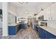 Modern kitchen with stainless steel appliances, two-toned cabinets, and hardwood flooring at 6468 S Forest St, Centennial, CO 80121