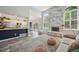 Spacious living room with fireplace, updated kitchen, and lots of natural light at 6468 S Forest St, Centennial, CO 80121