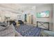 Bright open-concept living room with hardwood floors and views of the dining room at 6468 S Forest St, Centennial, CO 80121