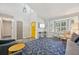 Open-concept living room with ample natural light, modern decor, and hardwood floors at 6468 S Forest St, Centennial, CO 80121