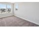 Well-lit bedroom features natural light and a minimalist design at 5583 Riverbend Ave, Firestone, CO 80504