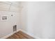 Functional laundry room featuring laminate flooring and ample space at 5583 Riverbend Ave, Firestone, CO 80504