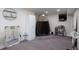 Finished basement with unique architectural design, large mirror, and tanning tent at 1801 Aspen St, Fort Lupton, CO 80621
