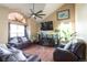 Cozy living room with vaulted ceilings, a ceiling fan, large windows and lots of natural light at 1801 Aspen St, Fort Lupton, CO 80621